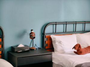 a bedroom with a bed with a toy horse on a table at Rest collection Gion-Shijo Kyoto in Kyoto