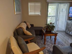 a living room with a couch and a table at Blissful in Hilton Head Island