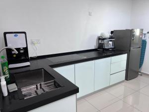 Kuchyň nebo kuchyňský kout v ubytování Metropol Serviced Apartment Bukit Mertajam Perda