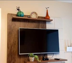 a flat screen tv sitting on top of a shelf at Hemingway Salinas Apartment in Salinas