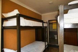 Postel nebo postele na pokoji v ubytování Paradise Guest House