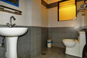 a bathroom with a sink and a toilet at Paradise Guest House in Kathmandu