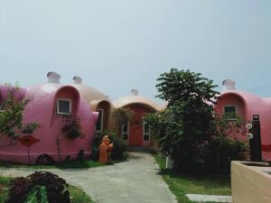 a house that is painted in pink at Kenting Ha-Bi Star Fort in Hengchun South Gate