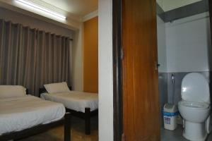 Postel nebo postele na pokoji v ubytování Paradise Guest House