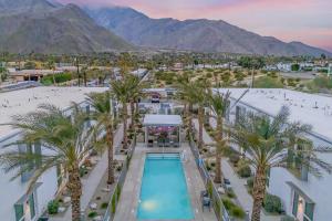 an aerial view of a resort with a pool and palm trees at Zanjero by AvantStay Mins from Downtown Palm Springs Private Terrace Shared Pool in Palm Springs