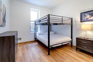 a bedroom with two bunk beds and a dresser at Central Chicago Suite2 Access to Patio in Chicago