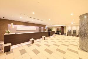 an office lobby with a reception desk and a check in counter at Richmond Hotel Tokyo Suidobashi in Tokyo