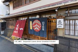 Un certificado, premio, cartel u otro documento en Kappo Ryokan Uoichi