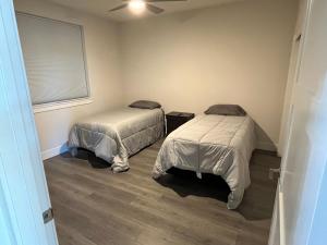 a room with two beds and a window in it at Two bedroom with river access in Redding