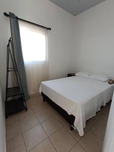 Giường trong phòng chung tại Mini casa Ecoterra Santa Ana