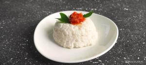 a piece of white rice on a white plate at Marian Villa in Katunayake
