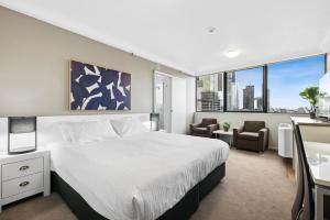 Ένα ή περισσότερα κρεβάτια σε δωμάτιο στο Central Brisbane Studio with Stunning River Views