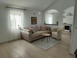 a living room with a couch and a table at Apartment Nika in Umag