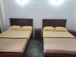 Postel nebo postele na pokoji v ubytování Shalom Bungalow
