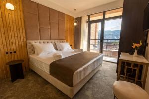 Postel nebo postele na pokoji v ubytování Bellevue Boutique Hotel