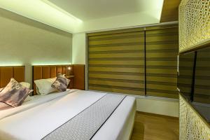Postel nebo postele na pokoji v ubytování Hotel Eden Serenity