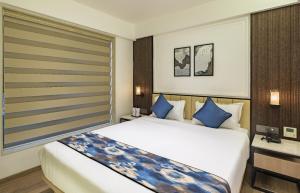 Postel nebo postele na pokoji v ubytování Hotel Eden Serenity