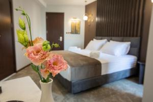 Postel nebo postele na pokoji v ubytování Bellevue Boutique Hotel