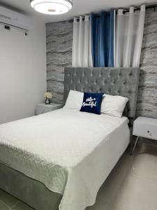 A bed or beds in a room at Garden city2