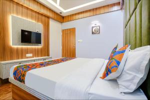 Voodi või voodid majutusasutuse FabHotel Max toas