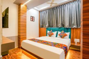 Voodi või voodid majutusasutuse FabHotel Max toas