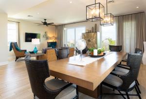 a dining room and living room with a table and chairs at The Shore House 4br-4,5ba in Key Largo