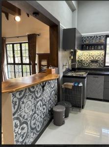 a kitchen with a counter top and a stove at The Chapters Villa in Alibag