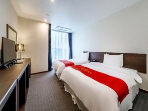 Postel nebo postele na pokoji v ubytování Hotel K-Tree Pyeongtaek