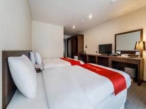 Postel nebo postele na pokoji v ubytování Hotel K-Tree Pyeongtaek