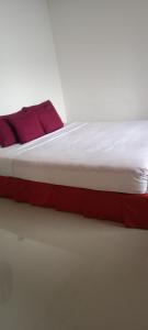 Postel nebo postele na pokoji v ubytování Toraja Sanggalangi Homestay