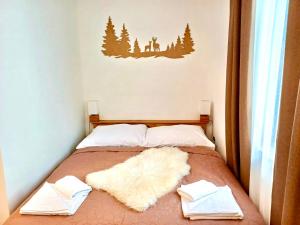 Postel nebo postele na pokoji v ubytování Paseky Apartments Resort + 37 fotografií