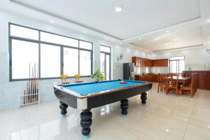 a living room with a pool table in it at C2.53 Hoàng My Villa in Vung Tau