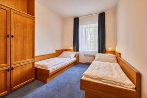 Postel nebo postele na pokoji v ubytování Hotel Auri