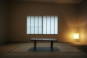 a bench in a room with a window and a lamp at SOUQ Renovated Townhouse in Himeji Quiet Market District in Himeji