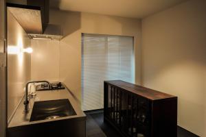 a kitchen with a sink and a window at SOUQ in Himeji