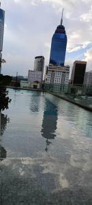 a large body of water in a city with buildings at Quill residences HAUSOME SKY in Kuala Lumpur