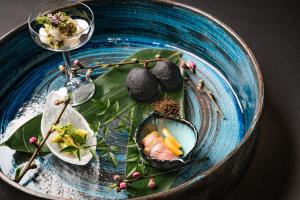 a blue plate with some food on it at XYZ speciale in Shirahama