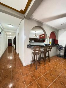 a kitchen and dining room with a table and chairs at Casa genesis in Panajachel