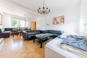 a living room with a couch and a table at Private House in Hannover