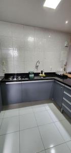 a kitchen with a sink and a counter top at Studio La Amazon in Belém