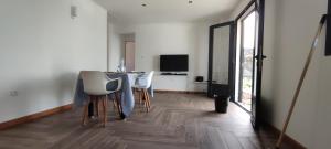 a dining room with a table and some chairs at Villa la fournaise in Le Tampon