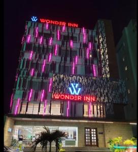 a building with pink lights on top of it at Wonder Country-Club in Barādiha