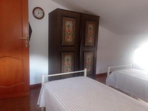 Кровать или кровати в номере Mansarda con terrazzo vista mare