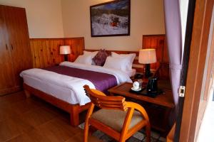 Una cama o camas en una habitación de The Dharmas Resort