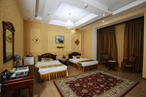 Postel nebo postele na pokoji v ubytování ORIYO DUSHANBE HOTEL