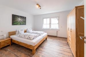 Postel nebo postele na pokoji v ubytování Ferienwohnung Haus An der Lenne