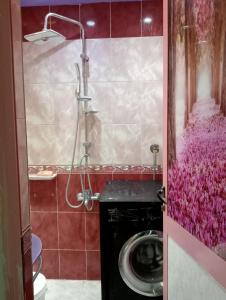 a bathroom with a washing machine in a room at شقة فندقية في بورسعيد in Port Said