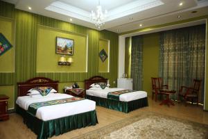 Postel nebo postele na pokoji v ubytování ORIYO DUSHANBE HOTEL