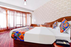 Postelja oz. postelje v sobi nastanitve FabHotel Himalyan Valley Resorts