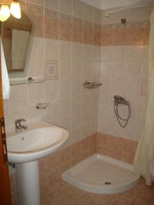 a bathroom with a sink and a shower at Maria Studios in Patitiri